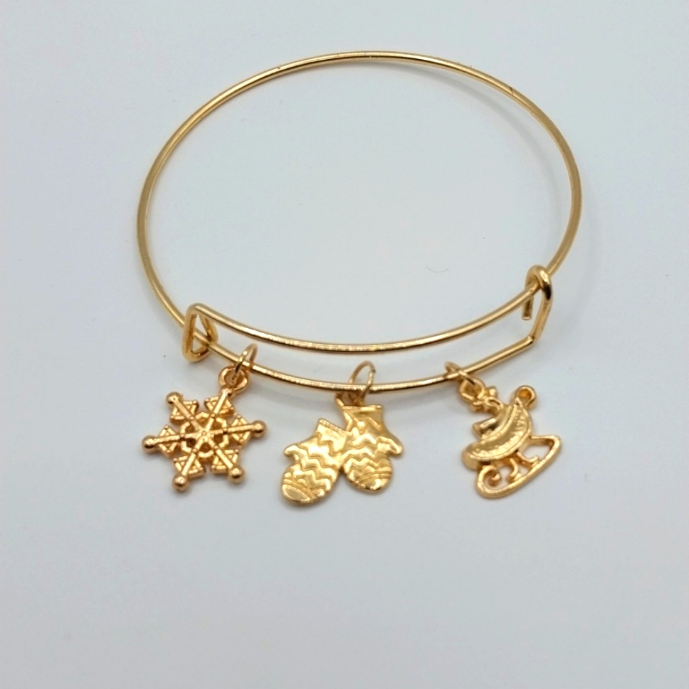 41 Gold Plated Bangle With 3 Charms 20$